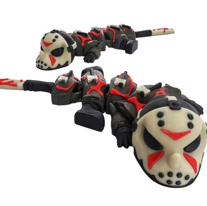Two black, red, and cream 3D-printed Jason Dragons showing their hockey-mask faces and segmented bodies against a white background.
