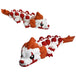 Two views of the compact Sewer Clown Dragon with a white body, red balloon details, orange clown hair and a boat-shaped tail.