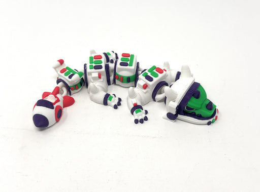 7-inch Space Astronaut Dragon in white, green, purple and red.